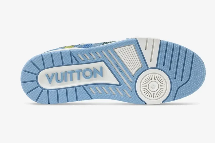 Bottom view of a light blue Louis Vuitton LV Trainer outsole with white VUITTON branding and textured grip. - SKU 1AHCYB