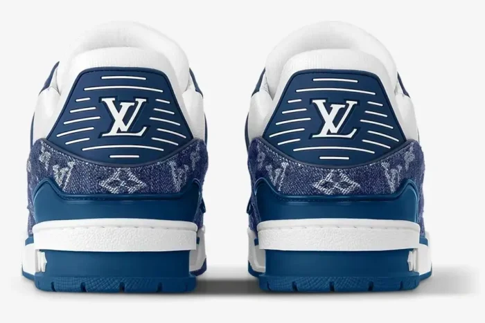 Rear view of Louis Vuitton LV Trainer Monogram Denim sneakers in white and blue. - SKU 1A9JGR