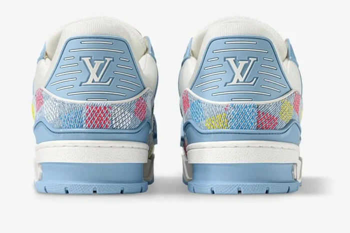 Rear view of light blue Louis Vuitton LV Trainer sneakers featuring multicolor monogram denim and damier patterns. - SKU 1AHCYB