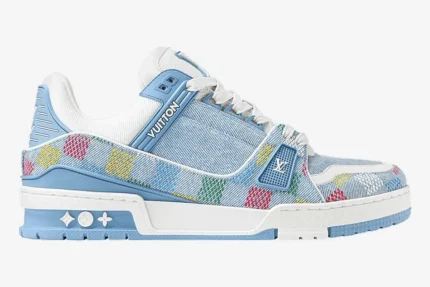 Louis Vuitton LV Trainer in light blue monogram denim with multi-colored Damier pattern, side profile view. - SKU 1AHCYB