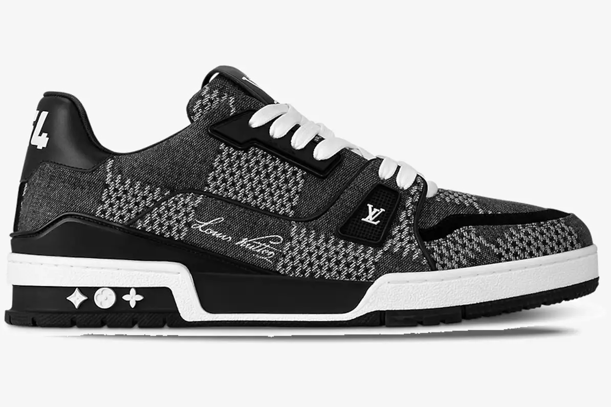 louis-vuitton-lv-trainer-plaid-damier-side-view-1a9zay-402-504 Side profile of a Louis Vuitton LV Trainer in black and white plaid Damier 3D pattern with white laces. - SKU 1A9ZAY