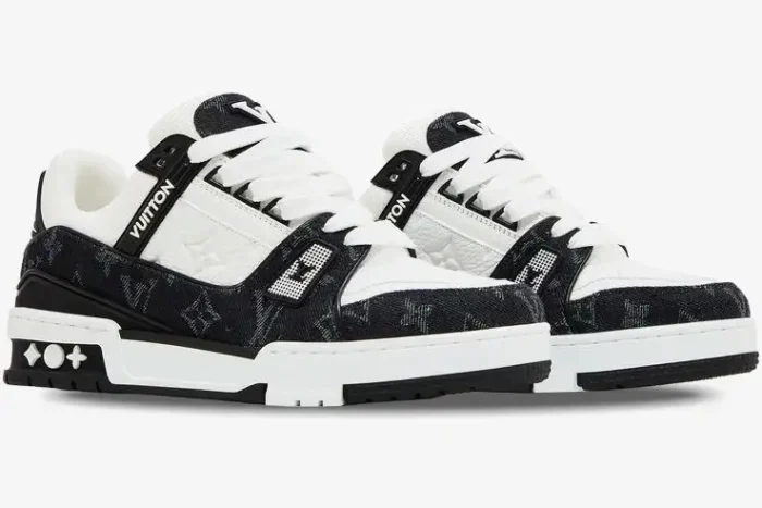 Louis Vuitton LV Trainer White Black Monogram Denim sneakers, three-quarter side view of the pair. - SKU 1A9JG9