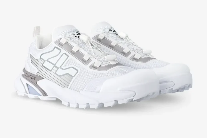 White and grey Louis Vuitton Runner Tatic sneakers shown from a three-quarter side perspective. - SKU 1A9U19