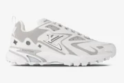 Side profile of a Louis Vuitton Runner Tatic sneaker in white and grey with LV logo and mesh panels. - SKU 1A9U19
