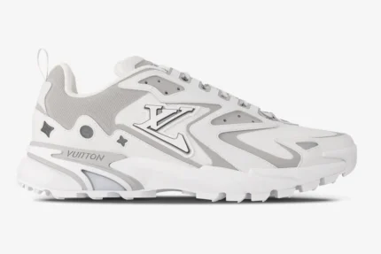 Side profile of a Louis Vuitton Runner Tatic sneaker in white and grey with LV logo and mesh panels. - SKU 1A9U19