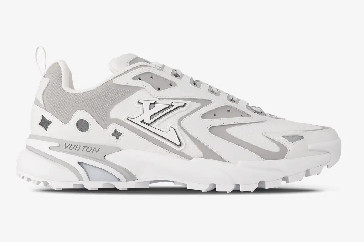 louis-vuitton-runner-tatic-white-grey-side-view-1a9u19-059-271 Side profile of a Louis Vuitton Runner Tatic sneaker in white and grey with LV logo and mesh panels. - SKU 1A9U19
