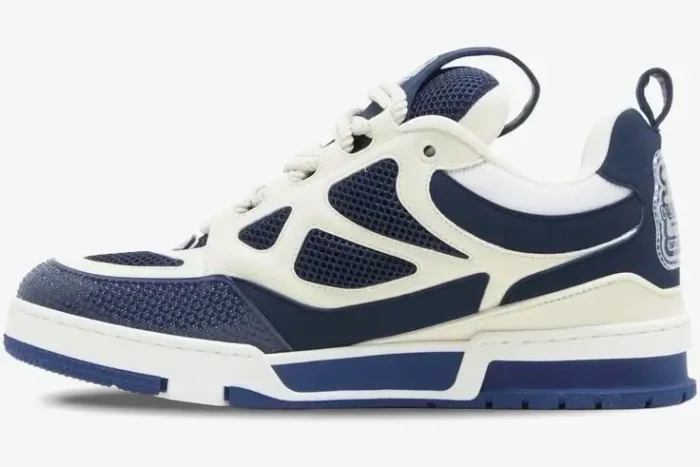 Side profile of Louis Vuitton LV Skate Sneaker in marine blue and white with mesh panels. - SKU 1AARRL