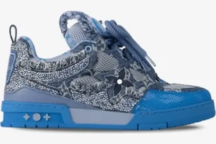 Side profile of a blue and silver Louis Vuitton Skate Sneaker with Swarovski crystals and denim details. - SKU 1ABMHB
