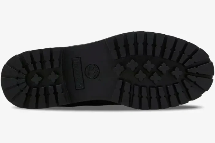 Bottom view of the black Louis Vuitton x Timberland 6-Inch Ankle Boot showing the lugged rubber outsole. - SKU 1AD75A