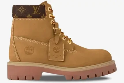 Side profile of a wheat-colored Louis Vuitton x Timberland 6-inch ankle boot with LV monogram collar. - SKU 1AD751