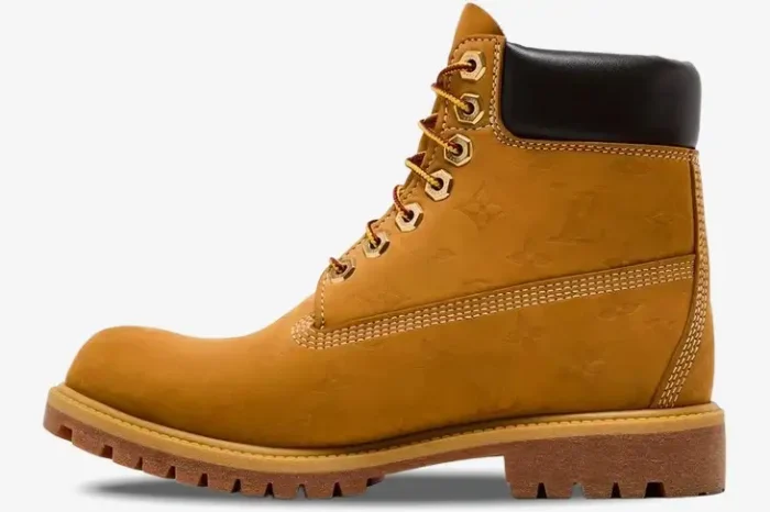 Side profile of a tan Louis Vuitton x Timberland 6-inch ankle boot with embossed monogram pattern. - SKU 1AD72X