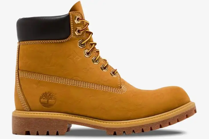 louis-vuitton-timberland-6-inch-boot-tan-side-1ad72x-473-691 Side profile of a Louis Vuitton x Timberland 6-inch ankle boot in monogram tan nubuck leather. - SKU 1AD72X