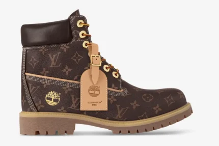 Side profile of a Louis Vuitton x Timberland 6-Inch Boot in brown monogram canvas with gold hardware. - SKU 1AD74B-ADB9D