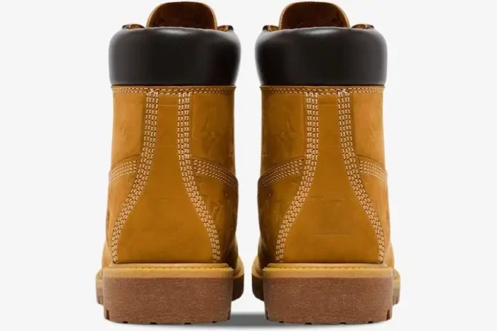 Rear view of Louis Vuitton x Timberland 6-Inch Ankle Boots in tan monogram leather with dark brown collars. - SKU 1AD72X