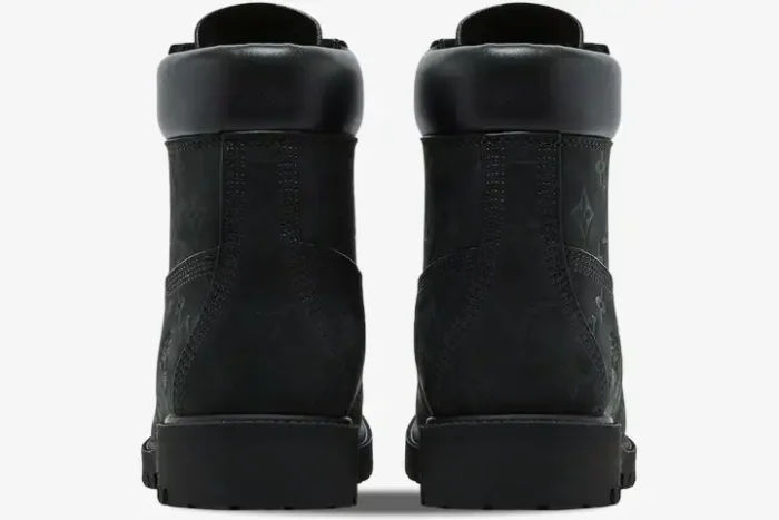 Rear view of black Louis Vuitton x Timberland 6-Inch Ankle Boots with embossed monogram pattern. - SKU 1AD73H