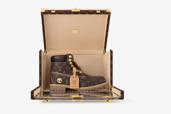 Louis Vuitton x Timberland 6-Inch Boot in Monogram Canvas Brown inside a luxury trunk, front view. - SKU 1AD74B-ADB9D