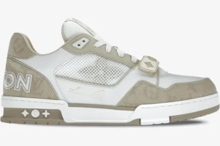Side profile of a Louis Vuitton Trainer Sneaker in beige monogram denim with a velcro strap and mesh panels. - SKU 1A9ZC2