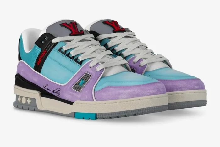 Louis Vuitton Trainer sneakers in blue and purple gradient pastel, three-quarter front view. - SKU 1AA6X0