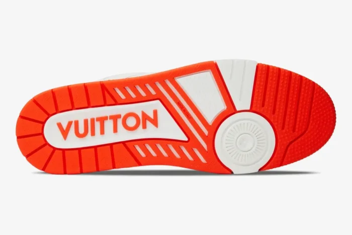 Bottom view of the orange and white Louis Vuitton Trainer Monogram Denim sneaker sole. - SKU 1A9ZBI
