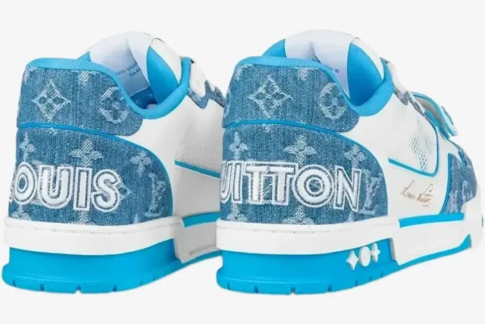 Rear view of light blue and white Louis Vuitton Trainer Low sneakers with monogram denim and heel branding. - SKU 1A9J1N