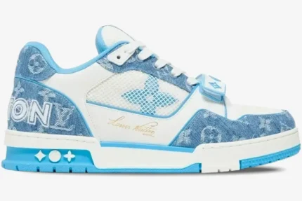 Side profile of Louis Vuitton Trainer Low in light blue monogram denim with white mesh and velcro strap. - SKU 1A9J1N