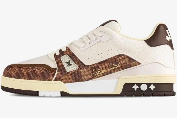 Side view of Louis Vuitton Trainer sneaker in white leather and brown Damier canvas with moka accents. - SKU 1ACV5P