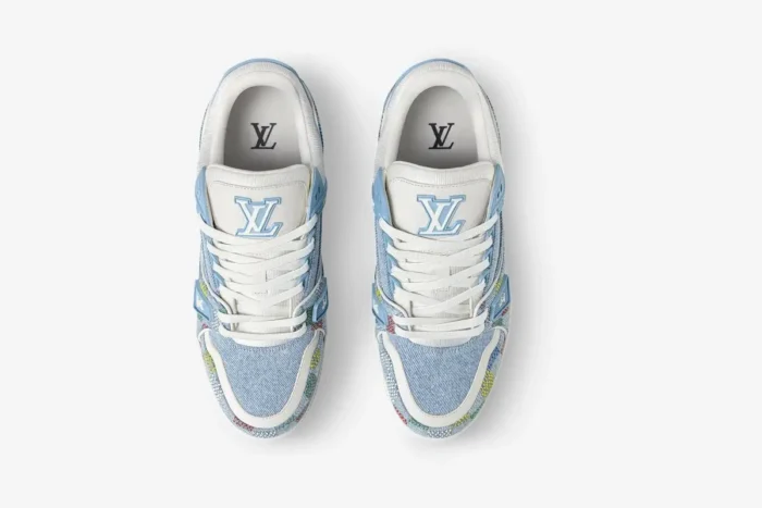 Top-down view of light blue Louis Vuitton LV Trainer sneakers in monogram denim. - SKU 1AHCYB