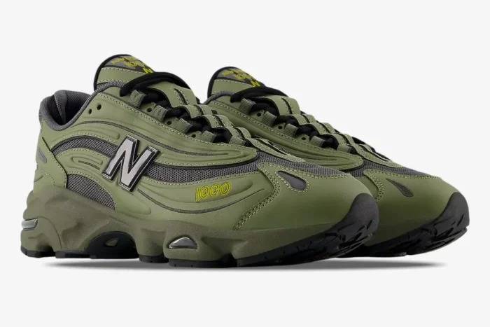 New Balance 1000 Olivine Black Olive sneakers in a three-quarter side view on a white background. - SKU M1000EA