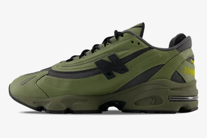 New Balance 1000 Olivine Black Olive sneaker, side profile view, featuring olive green overlays and black mesh. - SKU M1000EA