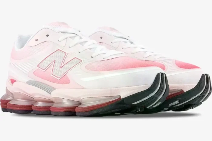 New Balance 2000 Rose Sugar Monarch sneakers in a three-quarter view with pink mesh and white overlays. - SKU U9060WNA