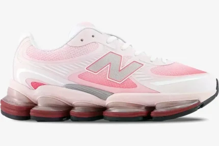 Side view of New Balance 2000 Rose Sugar Monarch sneakers in light pink and white with a chunky sole. - SKU U2000PBC