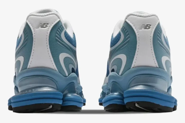 Rear view of New Balance 2000 sneakers in Still Water and Blue Agate showing heel details and chunky blue soles. - SKU U2000PBB