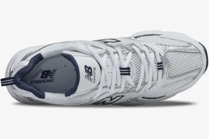 Top-down view of New Balance 530 sneakers in white, silver, and navy with mesh upper and white laces. - SKU MR530SG