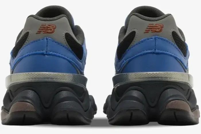 Rear view of New Balance 9060 sneakers in Dark Royal Brown with chunky black midsoles. - SKU U9060NRH
