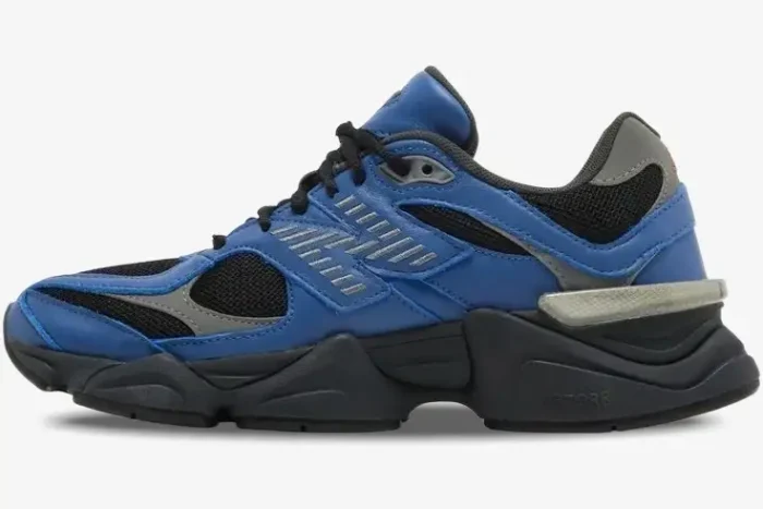 Side view of New Balance 9060 sneakers in dark royal blue and black with grey accents. - SKU U9060NRH