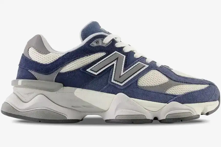 new-balance-9060-natural-indigo-side-view-u9060ind-179-128 Side profile of New Balance 9060 Natural Indigo sneakers featuring navy suede and grey mesh overlays. - SKU U9060IND