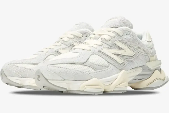 New Balance 9060 Quartz Grey sneakers in a three-quarter front view showing suede and mesh details. - SKU U9060HSA