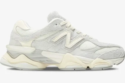 Side profile of a New Balance 9060 sneaker in Quartz Grey with a chunky cream sole. - SKU U9060HSA