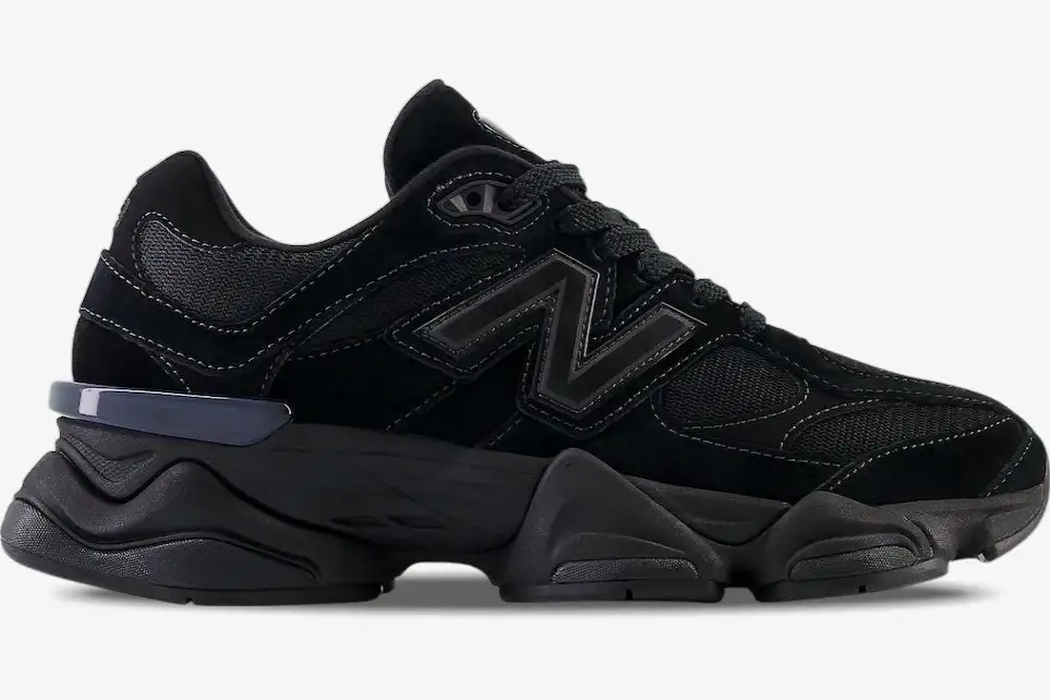 new-balance-9060-triple-black-side-view-u9060bpm-238-575 Side profile of New Balance 9060 Triple Black sneakers featuring a chunky sole and mesh upper. - SKU U9060BPM