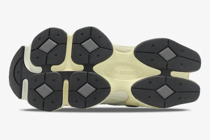 Bottom outsole view of New Balance 9060 White Grey Beige sneakers showing black traction pods. - SKU U9060AGAD