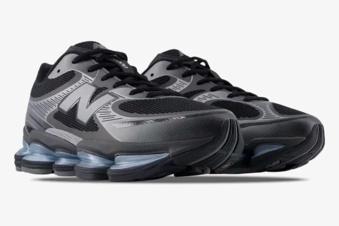 New Balance Abzorb 2000 black and silver metallic sneakers, low-angle front three-quarter view. - SKU U2000EA