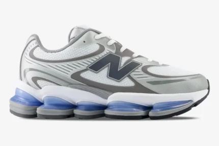 Side profile of New Balance Abzorb 2000 Grey sneakers with blue translucent cushioning pods. - SKU U2000AA