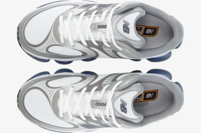 Top-down view of New Balance Abzorb 2000 sneakers in grey and white with blue sole details. - SKU U2000AA