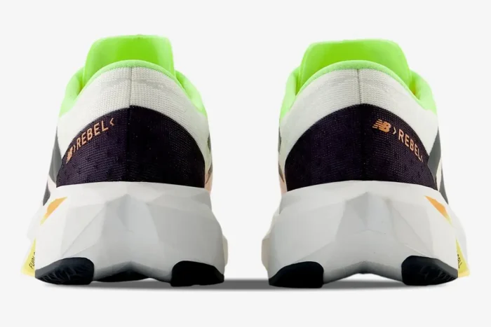 Rear view of New Balance FuelCell Rebel v4 running shoes in white and lime green. - SKU MFCXLL4