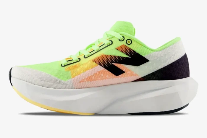 Side view of New Balance FuelCell Rebel v4 running shoe in white and lime green with a thick white midsole. - SKU MFCXLL4