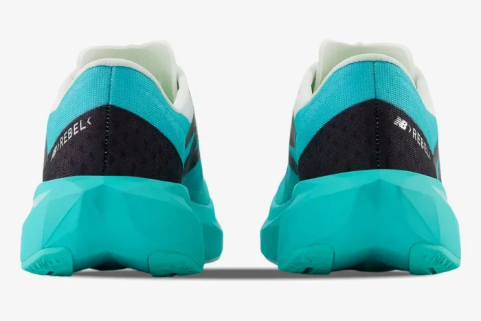 Rear view of New Balance FuelCell Supercomp Elite V4 running shoes in Cyber Jade and Black with geometric midsoles. - SKU WFCXCJ4