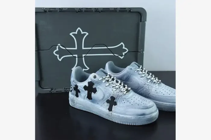 Custom light blue Air Force 1 Chrome Hearts sneakers with black cross patches and special box, three-quarter view.