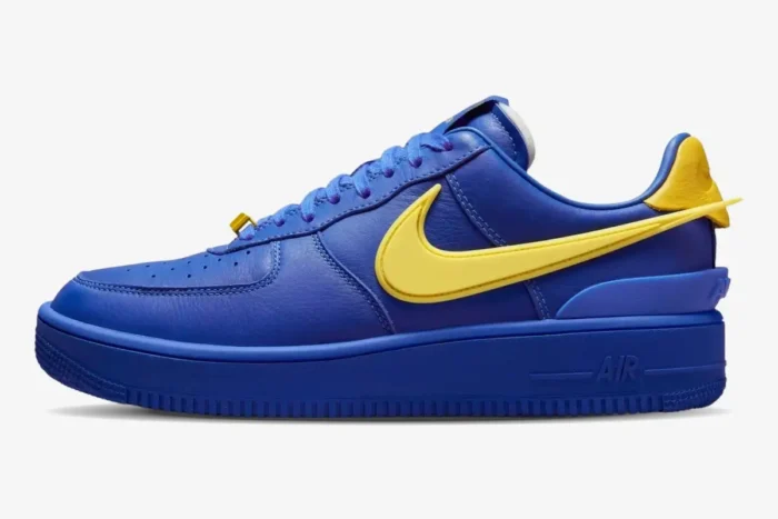 Side view of Nike Air Force 1 Low x Ambush in Game Royal blue with a Vivid Sulphur yellow oversized Swoosh. - SKU DV3464-400