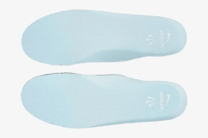 Top-down view of light blue Nike Air Force 1 Low x NOCTA Certified Lover Boy insoles with white branding. - SKU CZ8065-100