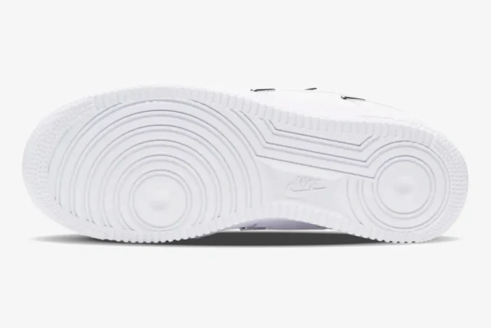 White sole of Nike Air Force 1 '07 LX Chrome Deluxe Women's shoe showing traction pattern. - SKU CT1990-100
